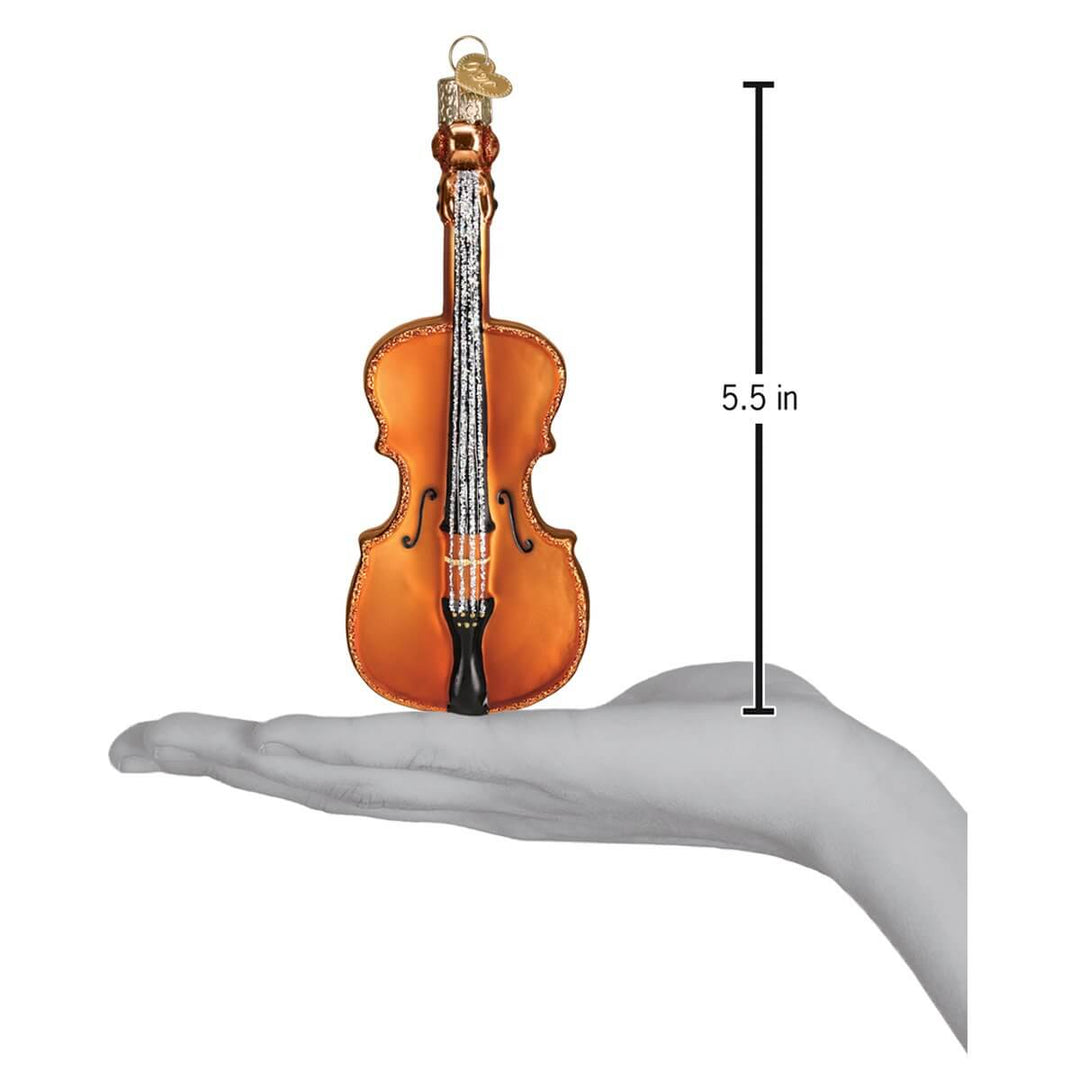 Handcrafted Glass Cello Christmas Ornament resting on hand with 5.5-inch height measurement