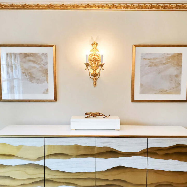 Handcrafted Italian Rococo Gold Leaf Wall Sconce illuminating a stylish room with elegant decor.