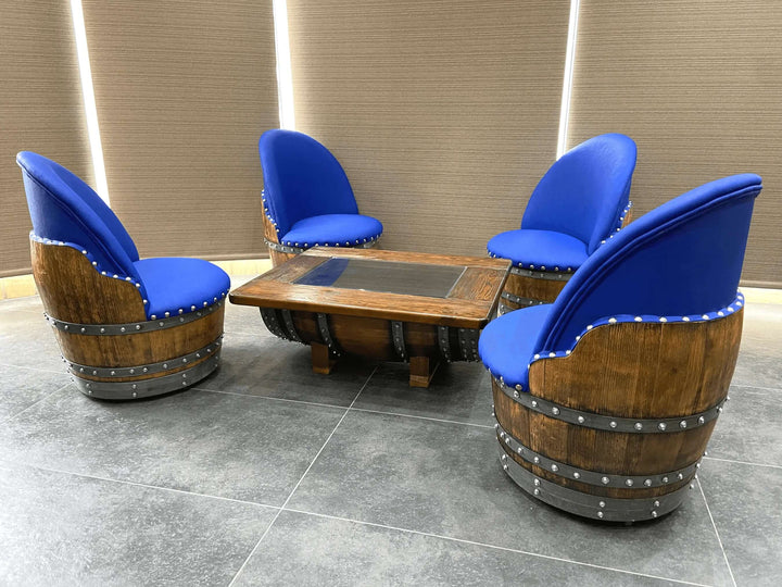 Handcrafted Vintage Oak Barrel Coffee Table and Chairs with blue upholstery showcasing farmhouse design and reclaimed wood artistry.
