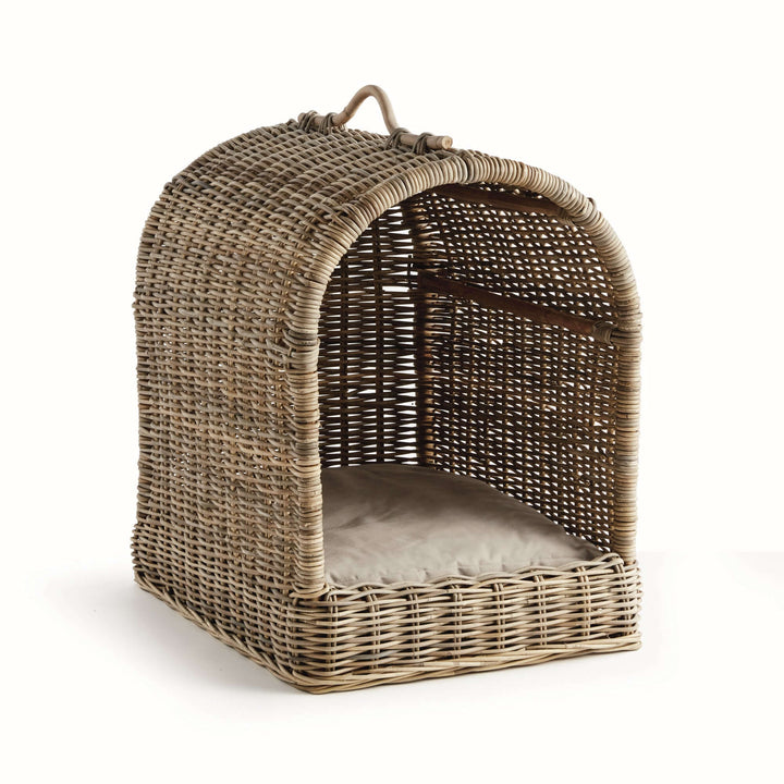 Handwoven rattan canopy dog bed with soft cushion for a cozy pet retreat.