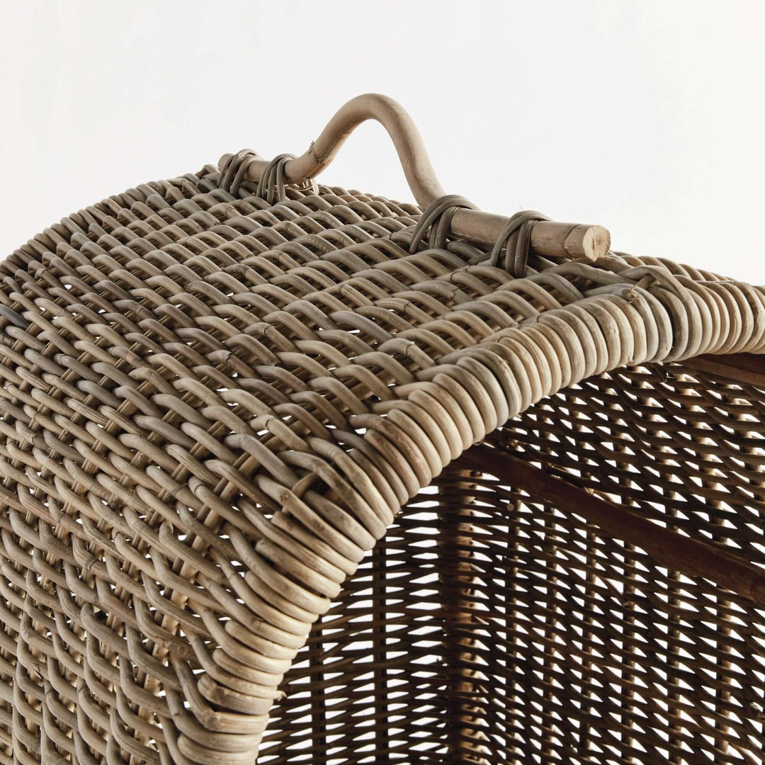 Close-up of the handwoven rattan canopy of a cozy dog bed, showcasing rustic design and craftsmanship.