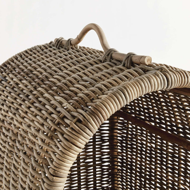 Close-up of the handwoven rattan canopy of a cozy dog bed, showcasing rustic design and craftsmanship.
