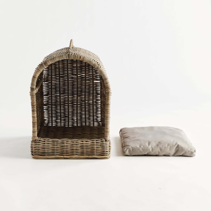 Handwoven rattan canopy dog bed with detachable cushion, providing stylish comfort for pets.