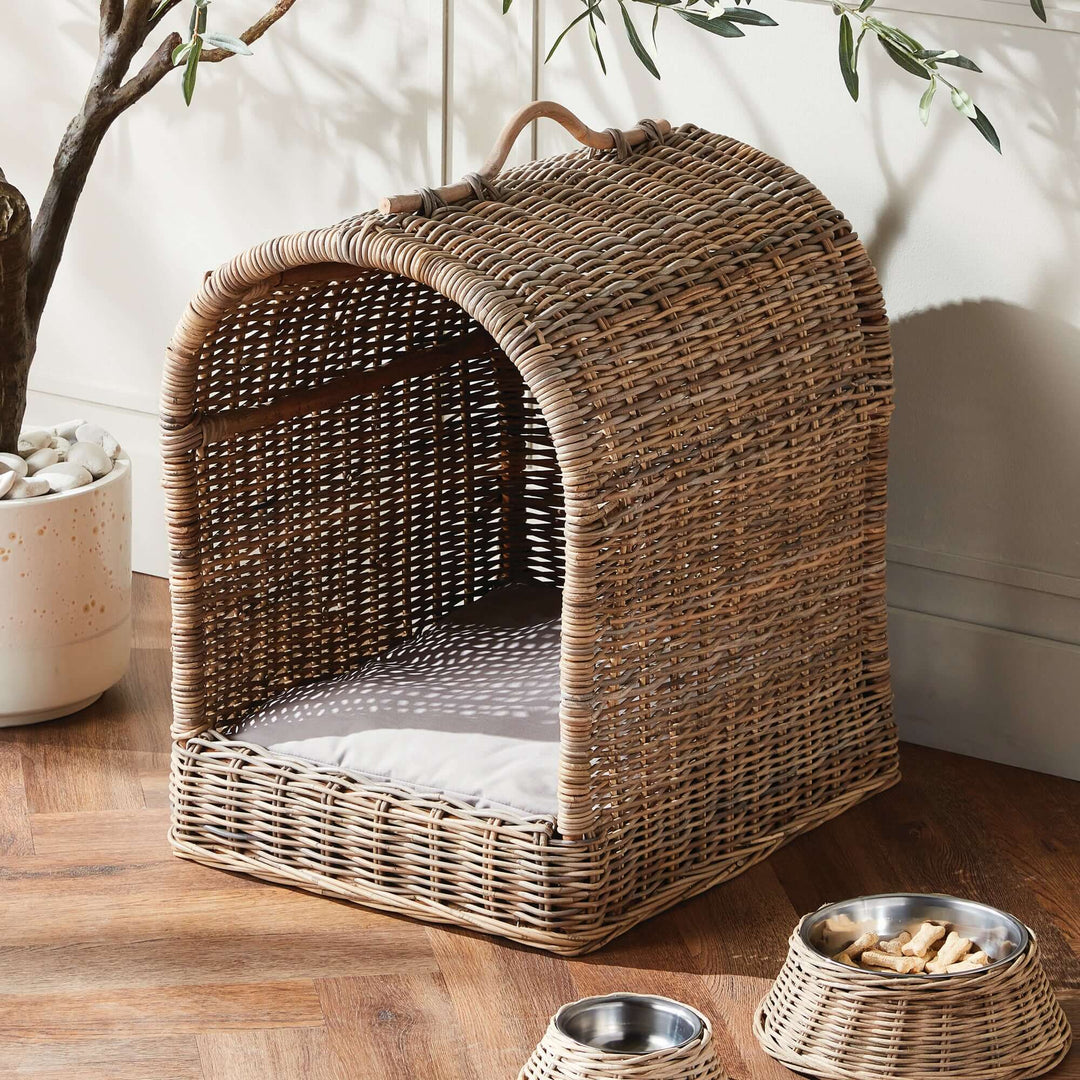 Handwoven rattan canopy dog bed with cushion, stylish pet retreat for dogs, cozy and natural design.