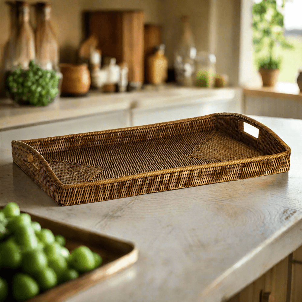 Rattan serving tray with handles in brown on a kitchen counter, ideal for vintage-inspired decor and everyday use.