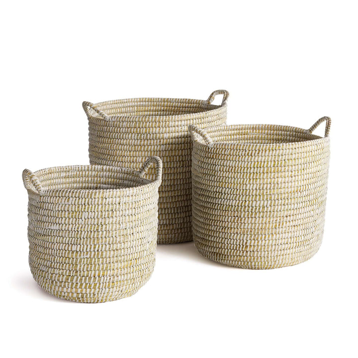 Handwoven rivergrass storage baskets in sand and driftwood hues, perfect for coastal decor, set of three.