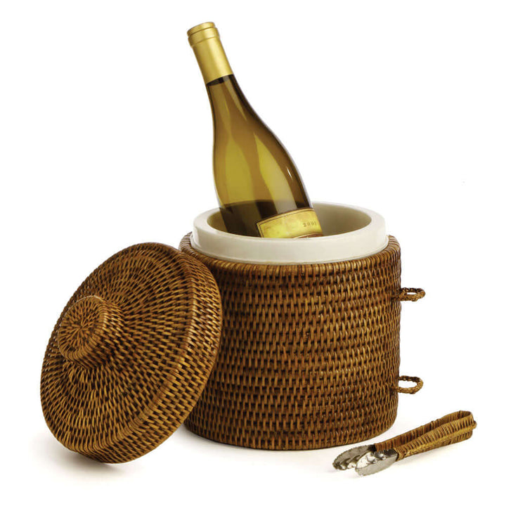 Handwoven vintage rattan ice bucket with tongs, featuring a wine bottle inside, showcasing timeless elegance.