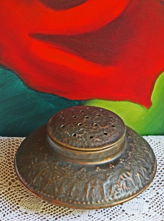 Antique Bronze Bird Incense Burner, Asian Ritual Vessel resting on lace with a colorful rose painting in the background.