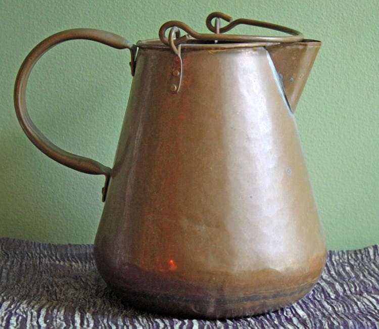 Antique Manning Bowman Copper Pewter Coffee Pot, Ornate Lid - Rustic Decor on a textured surface.