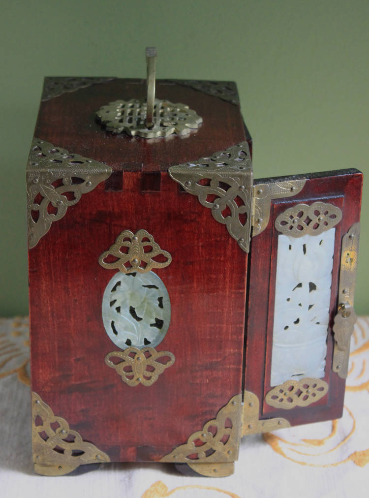 Handmade Vintage Wooden Jewelry Cabinet, Jade Insert Doors, Brass Hardware with intricate design and ornate handle.