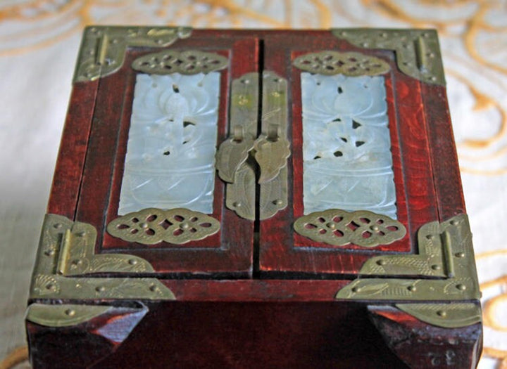 Handmade Vintage Wooden Jewelry Cabinet, Jade Insert Doors, Brass Hardware with intricately designed jade and brass details.