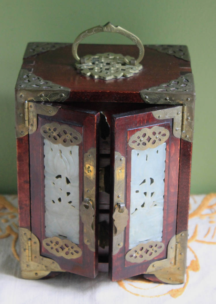 Handmade Vintage Wooden Jewelry Cabinet, Jade Insert Doors, Brass Hardware with ornate decorations.