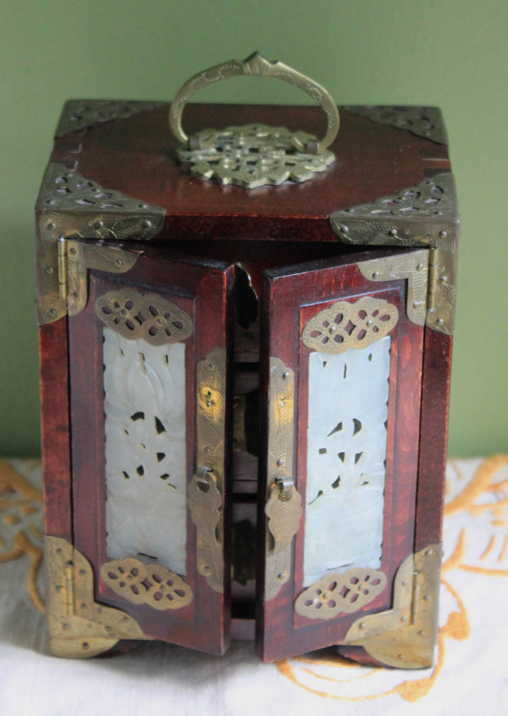 Handmade Vintage Wooden Jewelry Cabinet, Jade Insert Doors, Brass Hardware with ornate decorations.
