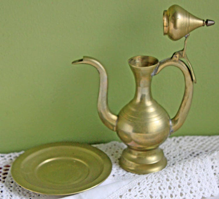 Vintage Brass Pitcher with Hinged Lid and Plate, featuring a pitcher and plate design, beautifully crafted in brass.