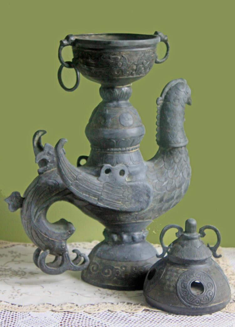 Antique Bronze Bird Incense Burner, Asian Ritual Vessel displayed on lace, showcasing intricate detailing and historical craftsmanship.