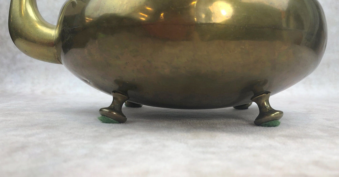 Antique Brass Kettle with Yellow Glass Handle, Footed Teapot, Home Decor showing detailed view of the footed base.
