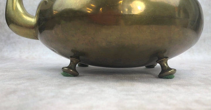 Antique Brass Kettle with Yellow Glass Handle, Footed Teapot, Home Decor showing detailed view of the footed base.