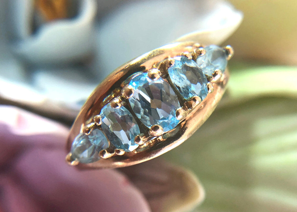 Vintage 10k Gold Ring with 5 Blue Topaz Stones showcasing beautiful oval blue topaz gems.
