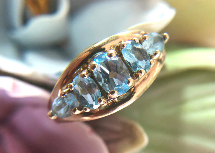 Vintage 10k Gold Ring with 5 Blue Topaz Stones showcasing beautiful oval blue topaz gems.