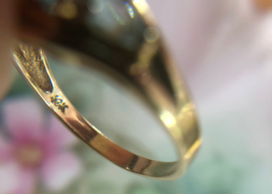 Vintage 10k Gold Ring with 5 Blue Topaz Stones showing the hallmarked "10k" for authenticity.