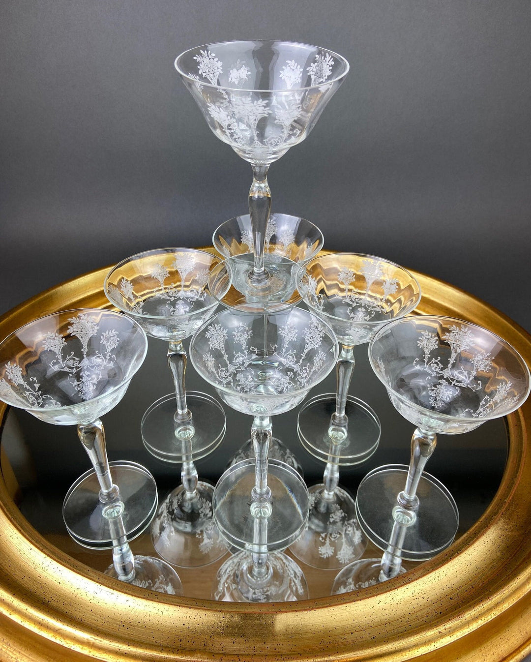 Vintage Morgantown Mayfair Etched Liquor Stemware, Set of 8 displayed on a reflective surface showcasing floral etching.