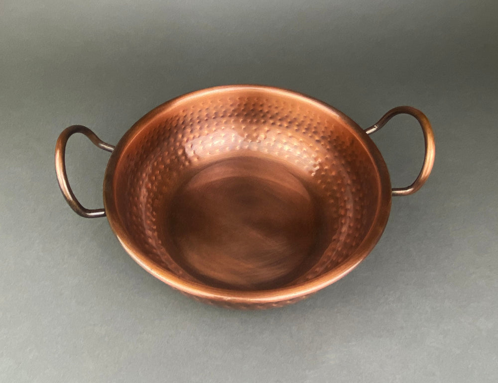 Vintage Hand Hammered Copper Bowl with Handles for Rustic Kitchen Decor.