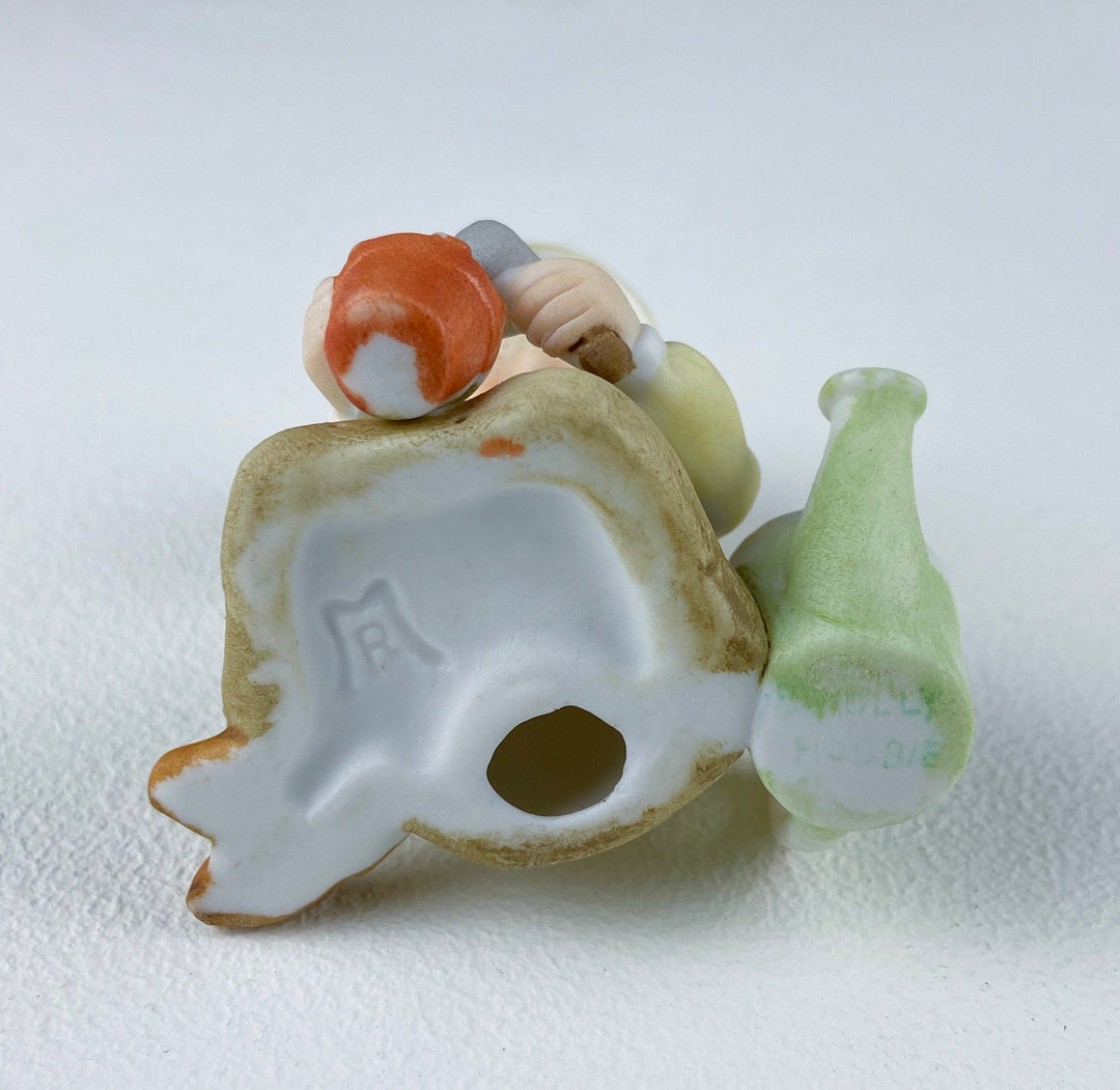 Porcelain Figurine by Marks & Rosenfeld of Little Girl Planting Flowers. Paired with Porcelain Birds in Nest.