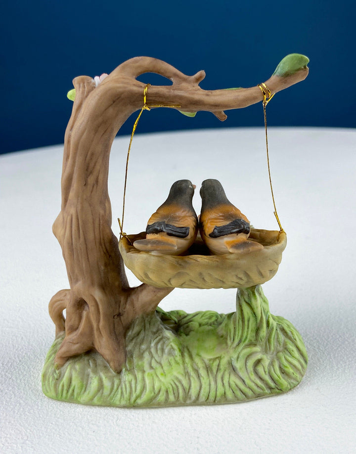 Porcelain Figurine by Marks & Rosenfeld of Little Girl Planting Flowers. Paired with Porcelain Birds in Nest.