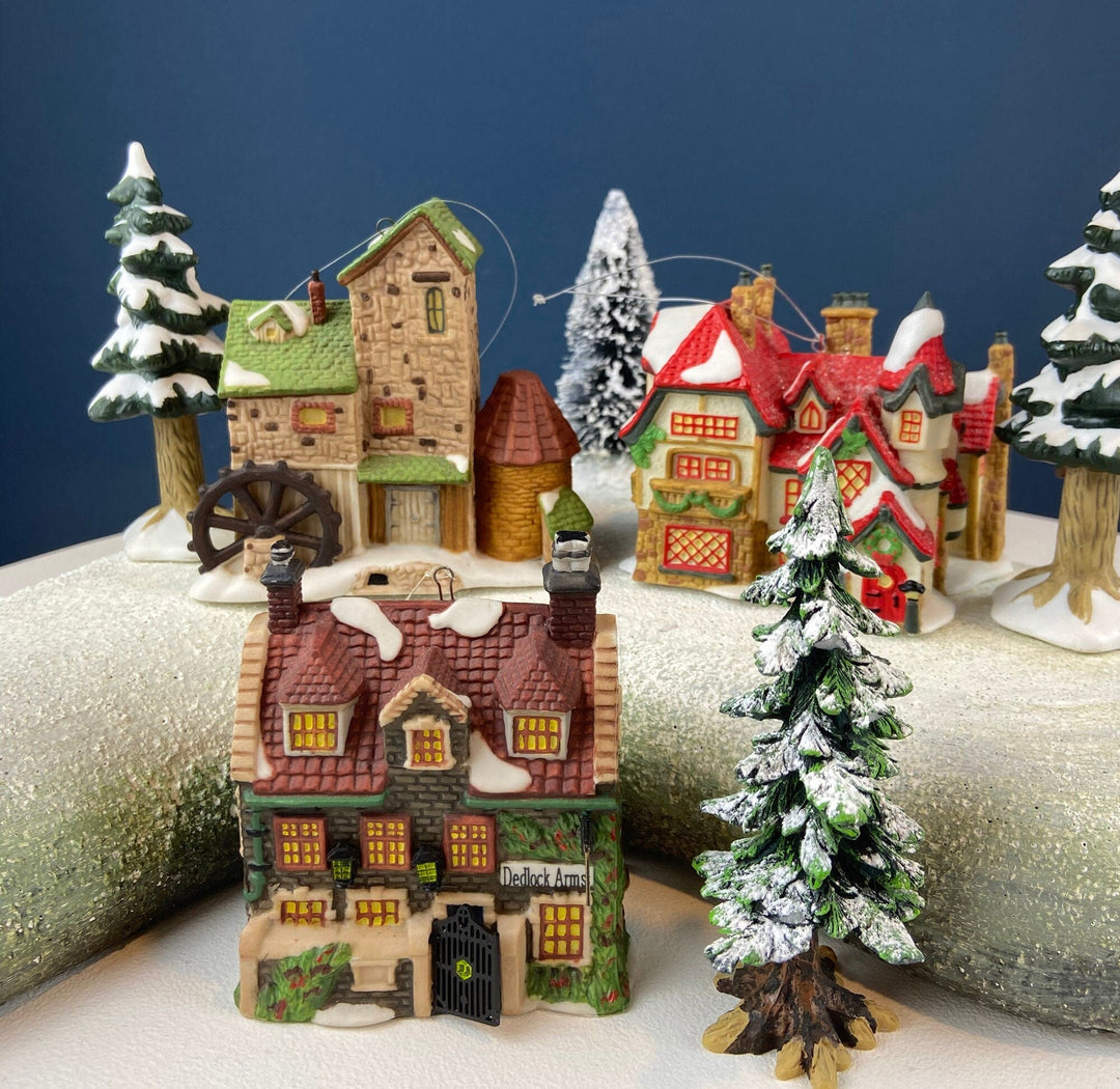 Set of 3 Tree Ornaments by Dept 56. Porcelain Hand Painted Bldgs.: Dedlock Arms, Santa's Workshop, and Dickens'Village Mill.