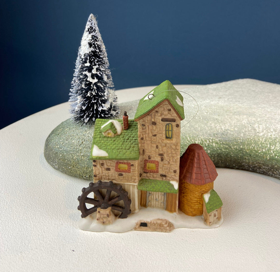 Set of 3 Tree Ornaments by Dept 56. Porcelain Hand Painted Bldgs.: Dedlock Arms, Santa's Workshop, and Dickens'Village Mill.