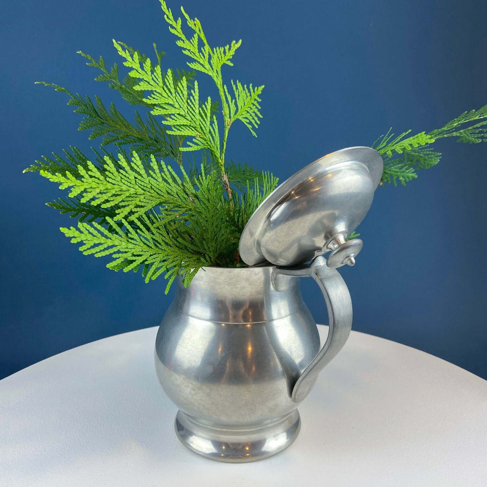Vintage Milton Mountain Joy Pewter Pitcher Vase, 64oz Rustic Decor with ferns in a stylish setting.
