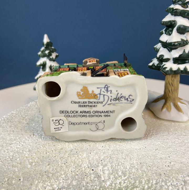 Back view of Dedlock Arms Ornament, showing Charles Dickens Heritage stamp and collector's details by Dept 56.