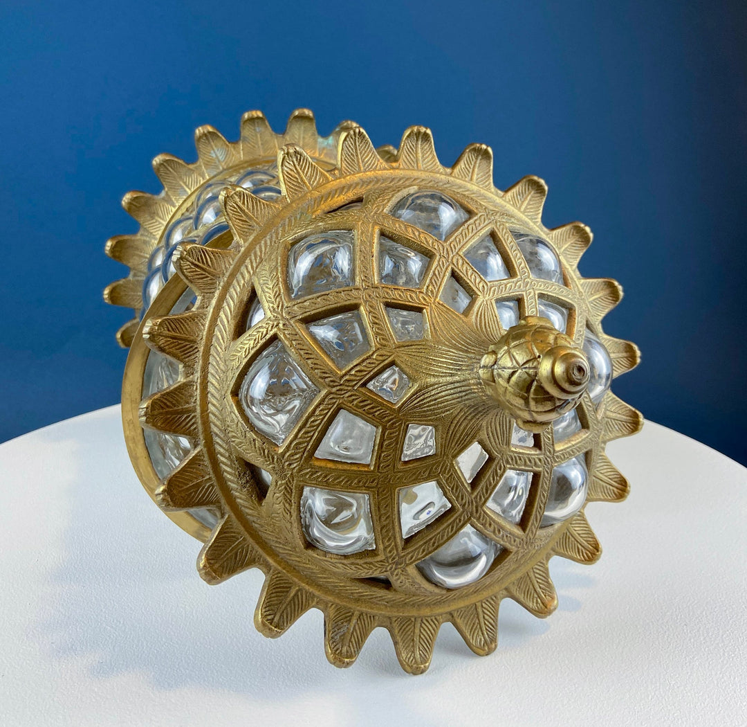 Vintage Hand Blown Bubble Glass Brass Urn Jar, Pineapple Design on display against a blue background.