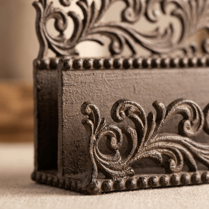 Close-up of the Bellavita Letter Holder's openwork acanthus scrollwork and beaded trim in dark bronze-brown cast metal