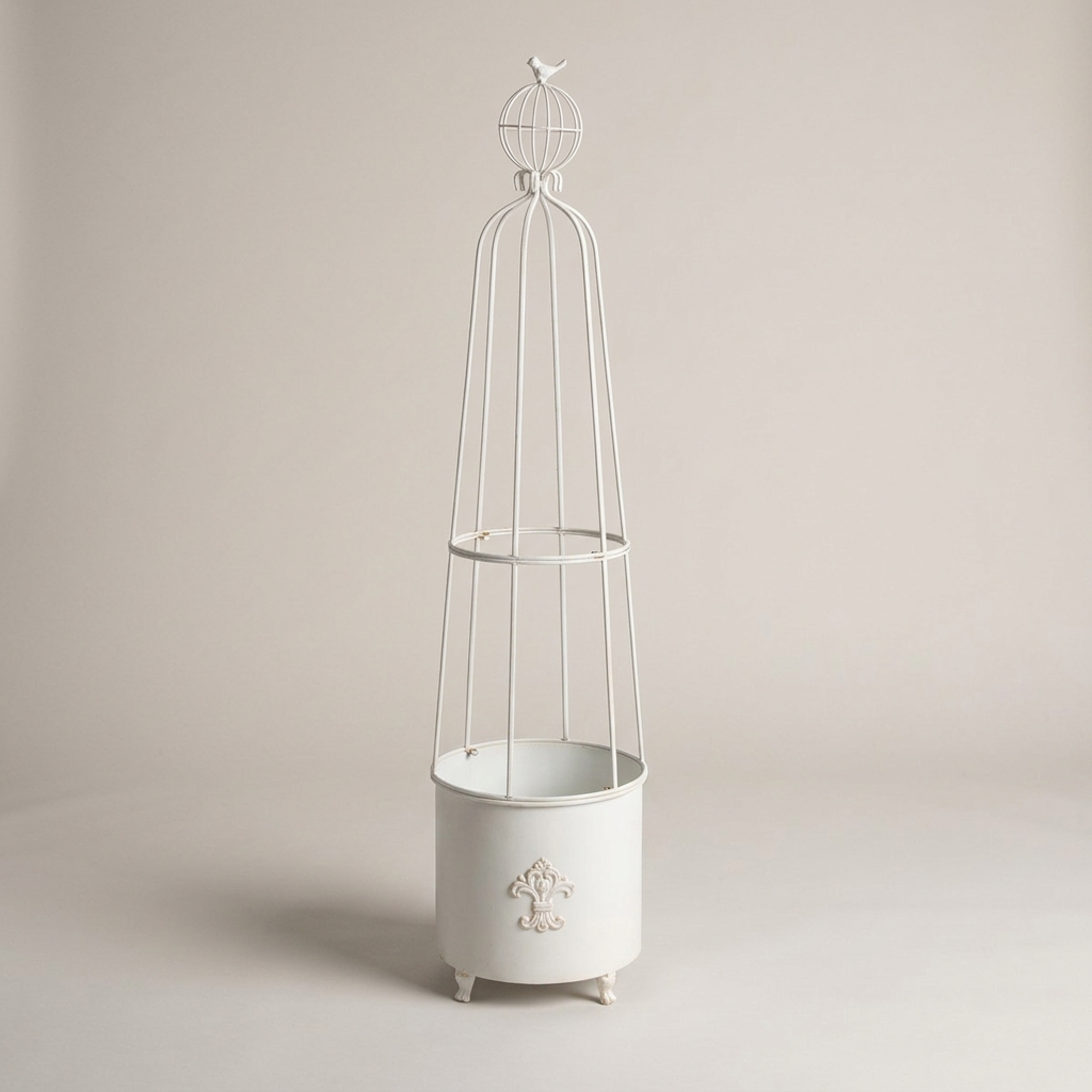 Antiqued White Fleur-de-Lis Garden Planter Obelisk on a warm gray studio background