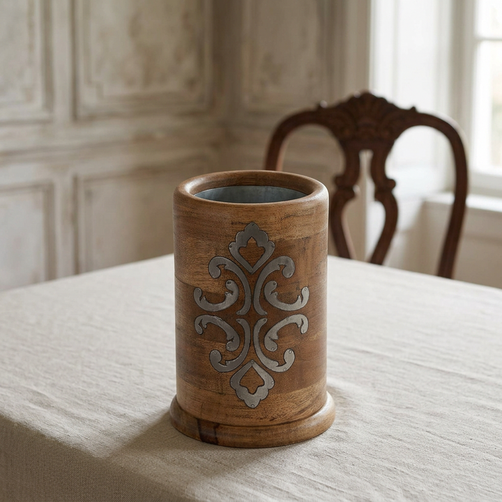 Belvedere wood wine chiller with metal scrollwork on a linen-covered dining table.