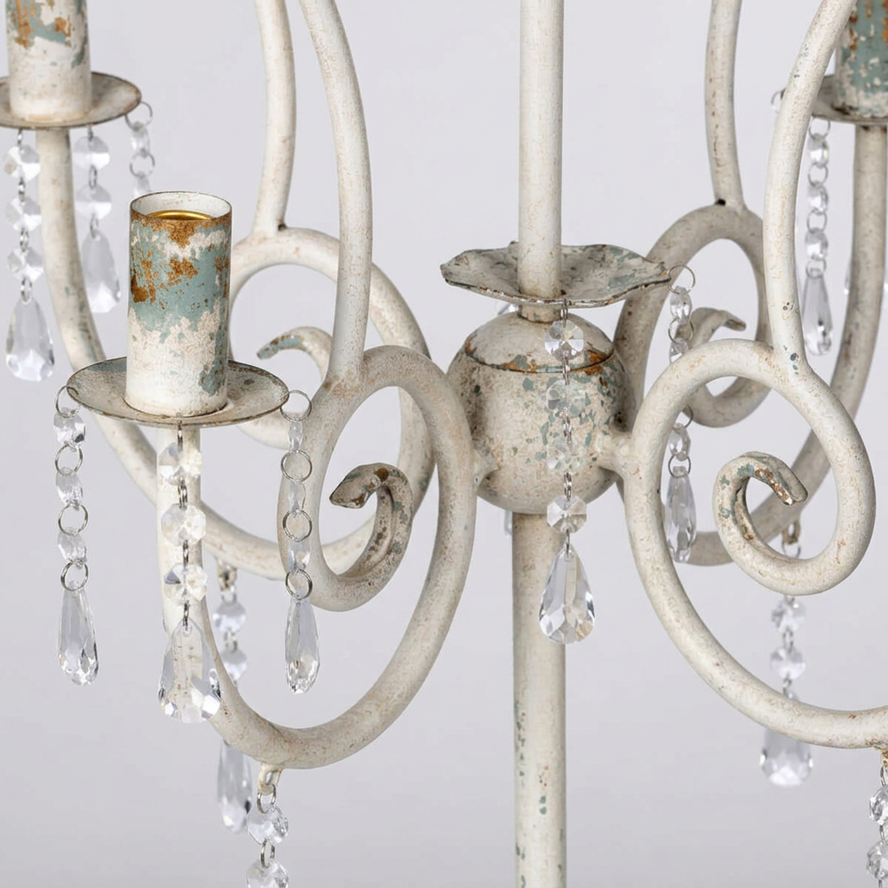Close-up of the French Country Crystal Table Chandelier showing distressed white iron scrollwork, candle-style sockets, and crystal drops.