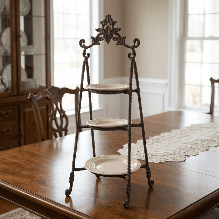 Bellavita three-tier stand with empty cream plates on a wooden dining table