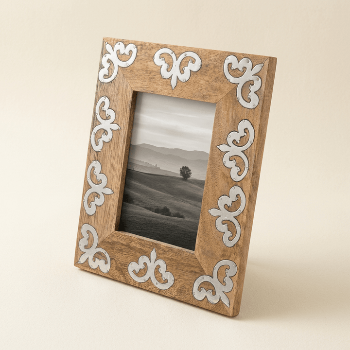 Belvedere mango wood photo frame with silver-tone scrollwork inlay on an ivory background.