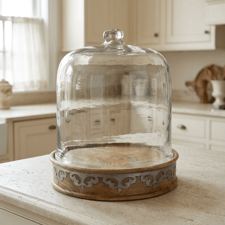 Belvedere Cake Keeper with Glass Dome on a pale stone island in a traditional cream kitchen.