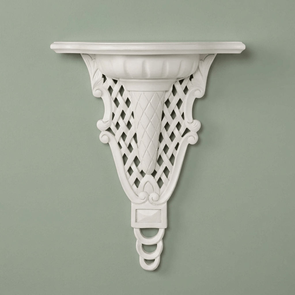 Front view of white Avelisse Wall Ledge showing diamond latticework against a sage wall.