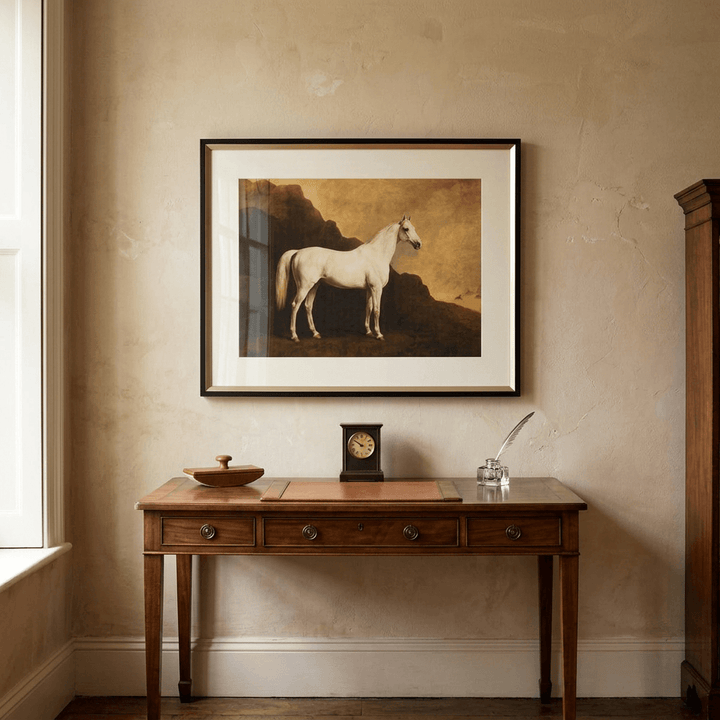 Single white thoroughbred framed horse print displayed above a walnut console in a country-house study.