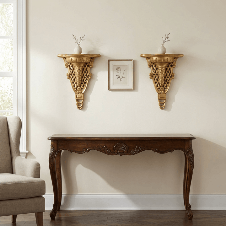 Two gold Avelisse Wall Ledges styled with petite vases above a wooden console in a softly lit sitting room.