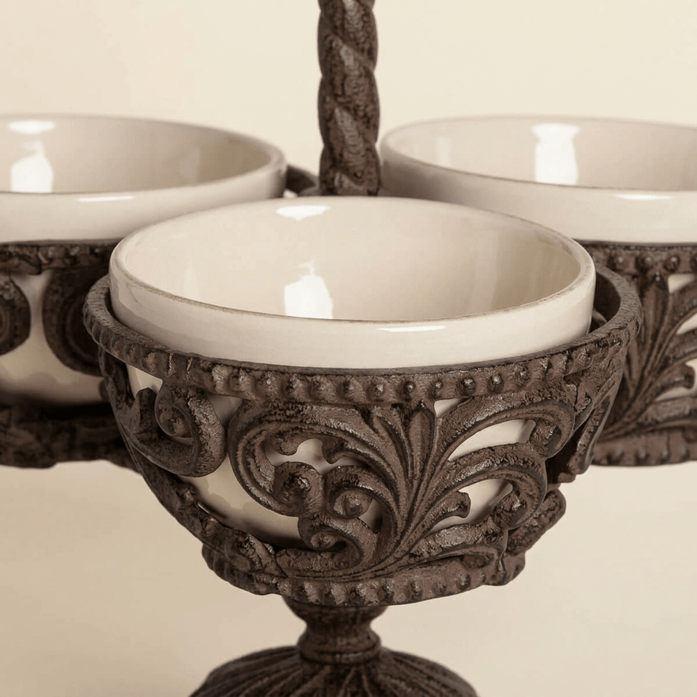 Close-up of cream ceramic bowl, beaded rim and scrolling acanthus metalwork on Bellavita Stoneware Condiment Server.
