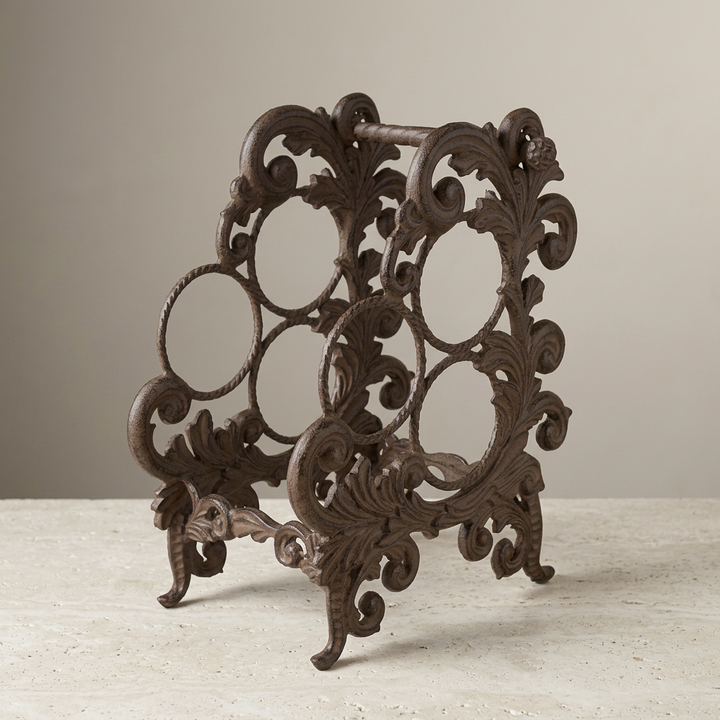 Bellavita Three-Bottle Wine Rack on a pale stone surface, showing its three bottle positions and scrolling feet.
