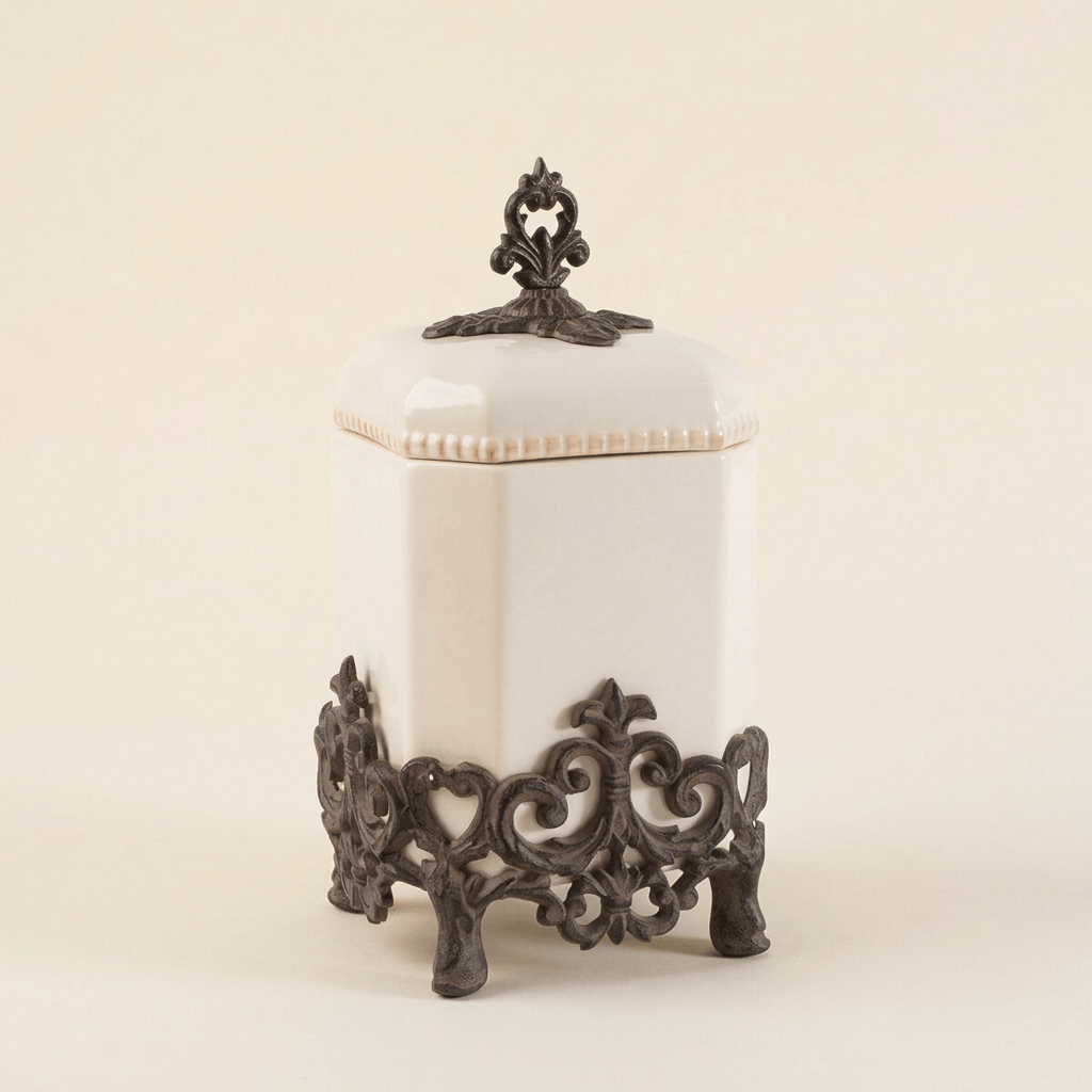 Bellavita cream stoneware canister, 14-inch option, with ornate dark metal base and finial on ivory.