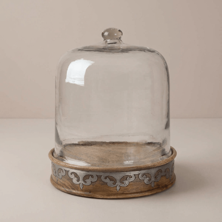 Belvedere Cake Keeper with Glass Dome showing the ornamental metal inlay against a taupe studio backdrop.