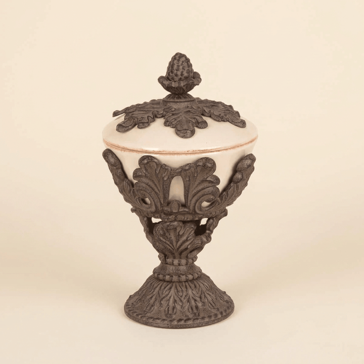 Bellavita Stoneware Lidded Nut Bowl, cream stoneware bowl with ornate dark acanthus metal cradle and leaf-topped lid, studio view on an ivory background