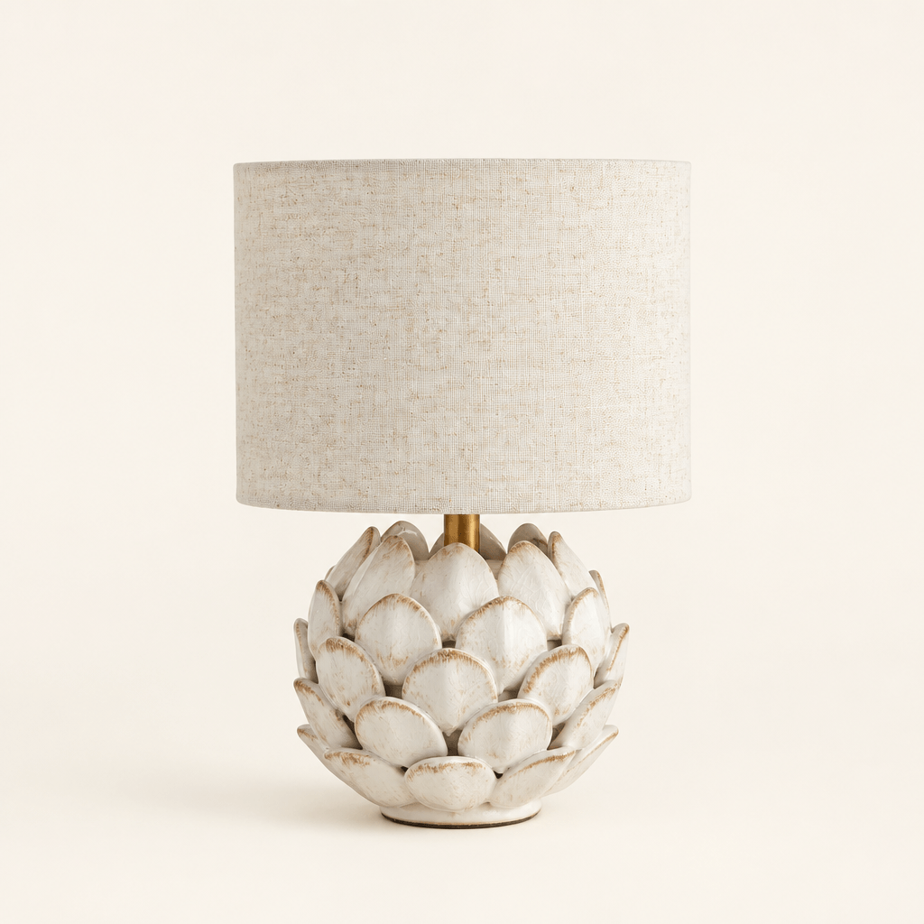 Antique white ceramic artichoke mini lamp with natural linen drum shade on an ivory background
