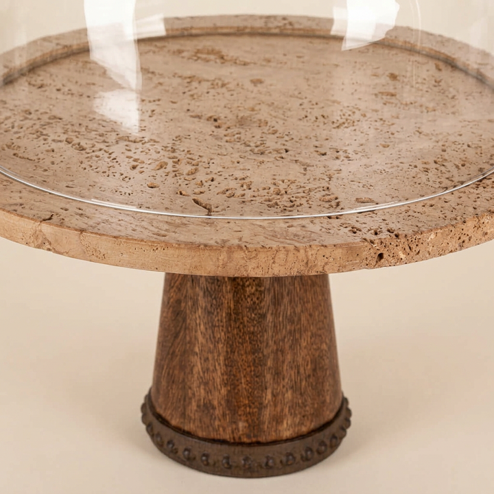 Close-up of Maribel cake stand showing warm marble, mango wood pedestal and metal foot detail.